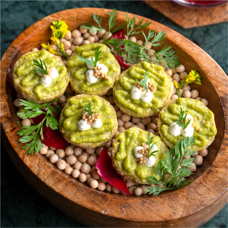 Braised Moringa, Oat Curry Granola with Feta